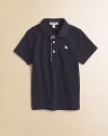 The beloved classic, in airy pique with woven check trim.Ribbed polo collar Short sleeves Front button placket with woven check trim Embroidered chest logo Cotton; machine wash Imported Please note: Number of buttons may vary depending on size ordered. 