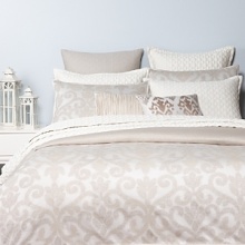 Inspired by Victorian scrollwork, this elegant bedding collection combines texture and pattern to create a luxurious atmosphere. Duvet and shams feature the woven scrollwork motif in muted neutral hues.