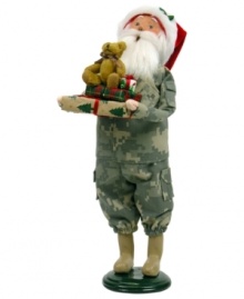 Singing their praises, Santa Claus honors military families in a camouflage suit and iconic red hat. In his arms are extra-special gifts piled high and topped with an adorable stuffed bear. An all-American figurine, handcrafted by Byers' Choice.