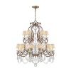 Glamour radiates from this medium-sized Ralph Lauren chandelabra, featuring eighteen bulbs topped with petite silk shades and draped with dazzling crystals.