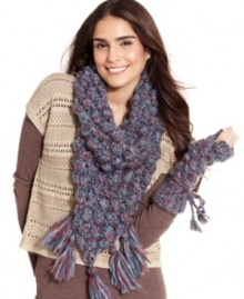 Keep your impeccable style going all season long with this ultra-cozy infinity scarf from Collection XIIX. With bubble stitch pattern and whimsical tassel detailing, it's easy to see why this design is a seasonal favorite.