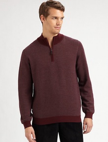 A sporty pullover with a sophisticated mockneck collar in a fine, textured diagonal knit.Ribbed mockneck collarHalf-zip frontLong sleeves with ribbed cuffsRibbed hemMerino woolDry cleanImported