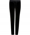 Work a modern edge into your laid-back look with Juicy Coutures jet black skinny velour pants - Drawstring elasticized waistline, tan grosgrain trim - Slim leg, figure-hugging fit - Team with oversized pullovers and chic fashion sneakers