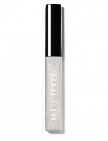 A gorgeous combination of light-catching glitter and non-sticky shine. Part of Bobbi's Caviar & Oyster Collection, this iridescent shade creates a pearly, nude lip: a perfect pairing for dark, intense eyes. The formula is enriched with emollients and Vitamins C and E to moisturize, condition and protect lips, too. Made in Canada. 