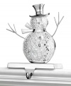 Best in snow. With a mirror mosaic, this silvertone metal stocking holder glistens like freshly fallen snow atop your mantel or bookcase.