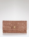 This petite clutch from Salvatore Ferragamo is a romantic evening option. In satin and lace, this textured compact adds instant under arm allure.