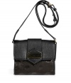 A darling addition to your Downtown look, Marc by Marc Jacobs dot embossed crossbody bag is the perfect size for toting around your daily (and cocktail) essentials - Textural leather flap with black and gold-toned dotted logo plaque, magnetic snap closure underneath, buckled shoulder strap, inside zippered back wall pocket, 2 front wall slot pockets - Wear with a leather jacket, skinnies and ankle boots