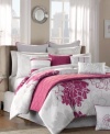 The Lola decorator set features dahlia graphics in hot pink and grey. Thin hot pink piping and alternating striped accents complete this sleek, urban look with a beautiful edge. In addition, the diamond quilted design across the coverlet and decorative pillow offer relaxing details and complementary texture.