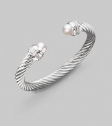 From the Silver Ice Collection. A signature Yurman cable of sterling silver, richly enhanced by bands of pavé diamonds encircling lustrous white freshwater pearl end caps. Diamonds, 0.48 tcw White freshwater pearls Sterling silver Cable, 7mm Diameter, about 2¼ Made in USA