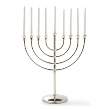 A new heritage piece for your family, this classic and elegant menorah is crafted from Christofle silver.