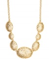 Dramatic design combines with subtle shimmer. Jones New York necklace features an intricate mix of asymmetrical circles and ovals with a sporadic dusting of round-cut crystals. Crafted in gold-plated mixed metal. Approximate length: 17 inches + 2-inch extender. Approximate drop: 1 inch.