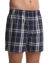 Hidden elastic waist band boxers with all over check pattern. One button fly.