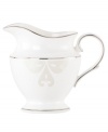 Refine your formal table with classic cream and white Lenox dinnerware. Dishes, including this Opal Innocence Scroll bone china creamer, are trimmed in platinum and accented with a raised dot and scroll pattern, bringing contemporary grace to special occasions. A pearlized finish adds subtle shimmer. Qualifies for Rebate