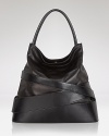 Crafted from leather with banded accents, Z Spoke Zac Posen's hobo bag has serious mix and match potential. Slouchy with a slight hint of edge, it's day luxe.