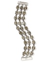 Wear three times the sparkle at your wrist with ABS by Allen Schwartz's chain and rhinestone bracelet. The triple-strand style adds instant drama and sparkle when you head downtown after dark.