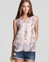 In a pastel snakeskin print, this Aqua blouse lends chic in a sleeveless silhouette, finished with a high-low hem.