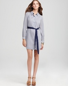 Crisp stripes lend preppy appeal to a Lilly Pulitzer shirt dress, cinched with a polka-dot belt for trend-right pattern mixing.