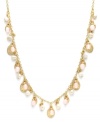 Sweet femininity. This delicate necklace from Lauren by Ralph Lauren charms with a delightful mix of freshwater pearls (4mm), pale pink jade accents, and metallic disc charms. Set in brass tone mixed metal and secured with a lobster claw clasp. Approximate length: 18 inches.