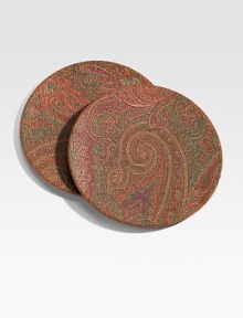 Beautiful coasters with PVC-coated fabric front and leather backing. Handcrafted in Italy in a sophisticated paisley print of swirling colors.Set of two coastersMeasure 5½ diam. ea.PVC-coated cotton/leatherMade in Italy