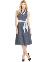 Flirty ruffles, polka dots and a chic A-line shape combine for a ladylike dress from Jones New York Signature.