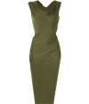 Luxurious dress in fine green stretch rayon - modern classic of the Donna Karan collection - a smashing dress with highly elegant wrap drape which creates a dream silhouette - feminine crew neck and short cap sleeves - slim and figure hugging cut with sexy waist fit - classic pencil knee length - a special dress for special events, from a cocktail party to a glamorous gala - a favorite for stylish women who quietly like to be in the center of attention - pair with platform pumps or sandals