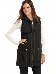 THE LOOKQuilted hoodWool blend stand collarSleevelessSingle gun flapZip frontDual welt & zip pocketsTonal pipingBack button tab detailTHE FITAbout 30½ from shoulder to hemTHE MATERIAL43% wool/30% rayon/27% polyesterTrim & fill: polyesterFully linedCARE & ORIGINDry cleanImported