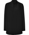 Perfect for wearing with your favorite leather leggings, Cacharels billowing black tunic top is a sleek choice with endless pairing possibilities - Short stand-up collar with front slit and tie, long sleeves, folded buttoned cuffs, softly curved hemline - Easy straight silhouette - Layer over slim fit trousers with suede ankle boots and statement chunky jewelry