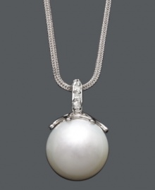 Highlight your neckline with a polished pearl and a hint of sparkle.  A single cultured South Sea pearl (14 mm) hangs from a delicate 14k white gold chain and bail accented with sparkling diamonds. Approximate length: 18 inches. Approximate drop: 1 inch.