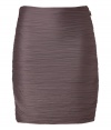 Ultra modern in an understated cool mauve hue, Halston Heritages crinkle-effect stretch skirt is a chic staple separate with endless pairing possibilities - Allover crinkle-effect, ruched sides, hidden side zip - Softly draped, form-fitting silhouette - Team with tees, oversized blazers and statement ankle boots