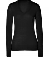 Building a coveted capsule wardrobe is easy with stylish staples like Iris von Arnims black pullover - Sumptuously soft in a luxe, lighter weight merino wool knit - Fitted, feminine cut tapers gently through waist and hits below hips - Long sleeves and flattering v-neck - Oversize rib trim at cuffs and hem - Versatile and classically chic, seamlessly transitions from work to weekend - Pair with everything from suit trousers and pencil skirts to skinny denim and leather pants