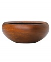 Less is more with this wooden salad bowl from Dansk's collection of serveware and serving dishes. Its simple round shape curves inward to contain mixed greens, lettuce and baby spinach, while the rich wood grain adds all-natural appeal.