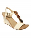 Natural meets sheer sophistication in the Seeking Cedar wedge sandals from Kenneth Cole Reaction. Its T-strap fit accentuates curvy legs while its riveted sole keeps your feet feeling comfy.