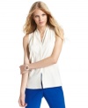 Vince Camuto puts a contemporary twist on this blouse, adding a chic stand collar and an edgy slit at the front hem.