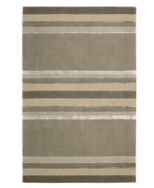 Linear designs are accented with exotic faux silk to create a timeless palette in the Sahara area rug from Calvin Klein. Crafted by skilled artisans in India, it features generously thick wool and viscose fibers woven to create remarkable strength and impeccable elegance.