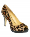 Animal magnetism. Nine West's Danee platform pumps are definitely an attraction, perfect for a night out on the town.