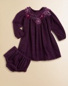 Plush, long-sleeve style with a smocked neckline and pretty flowers for an extra special touch. Round neckSmocked necklineLong sleeves with elastic cuffsButton back92% polyester/8% spandexHand wash or dry cleanImported