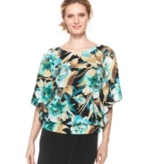 A tropical print adorns this chic Elementz top featuring fluttering batwing sleeves and a flattering banded waist. Pair it with black pants or a maxi skirt for an instantly chic look.