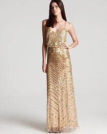 Covered in delicate beading, this blousy Adrianna Papell gown goes glamorous in a golden hue.