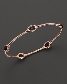 From the Rosé collection, five smoky quartz stations on a hammered bangle. Designed by Ippolita.