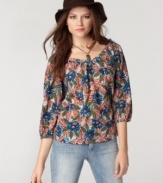 A vintage-inspired silhouette comes to life with a vibrant floral print in this top from Lucky Brand Jeans. Pair it with roughed up denim for weekend style that stays put-together.