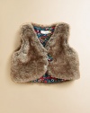 Baby's first faux fur vest reverses to a brilliantly printed corduroy design.V-neckSleevelessFront buttonCottonMachine wash or dry cleanMade in France of imported fabric