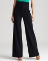 A workday staple gets a trend-right upgrade with these high-waist Nanette Lepore pants, ever-so chic with a silk blouse tucked in to reveal the forward silhouette.