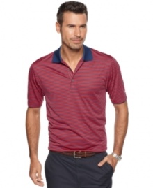 Hit your stride with stripes. Your style will be as solid as your play in this Izod shirt that features moisture wicking and UPF 15 protection for all-day comfort.