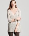 A longer length and relaxed silhouette distinguishes this Eileen Fisher tunic sweater as an off-duty wardrobe staple.