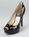 In slick patent leather, these MICHAEL Michael Kors pumps lend timeless style to the office and after hours.