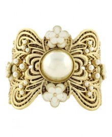 Lovely in lace. Jessica Simpson's intricate cuff bracelet combines elegance with a vintage aesthetic. Crafted in gold tone mixed metal with pretty simulated pearls and ivory resin flowers. Approximate diameter: 2-1/2 inches.