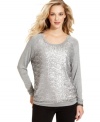 A classic knit sweatshirt gets embellished with sparkling sequins in this fashion-forward look from Cha Cha Vente.