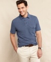 Simple casual style is this preppy polo from Tommy Hilfiger with a pocket accent.