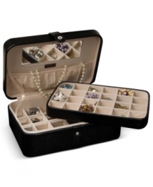 Beautiful inside and out, the Remy jewelry box houses innumerable trinkets between a lift-out drawer, divided sections and in-lid catch. A rich faux leather exterior and sparkling crystal snap add elegance to the practical storage solution by Mele & Co.