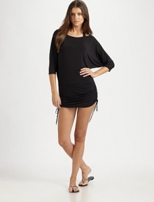 A flattering coverup with side ties for a customizable fit.Round neckThree-quarter sleevesSide tiesCord ends92% polyester/8% spandexHand washImported